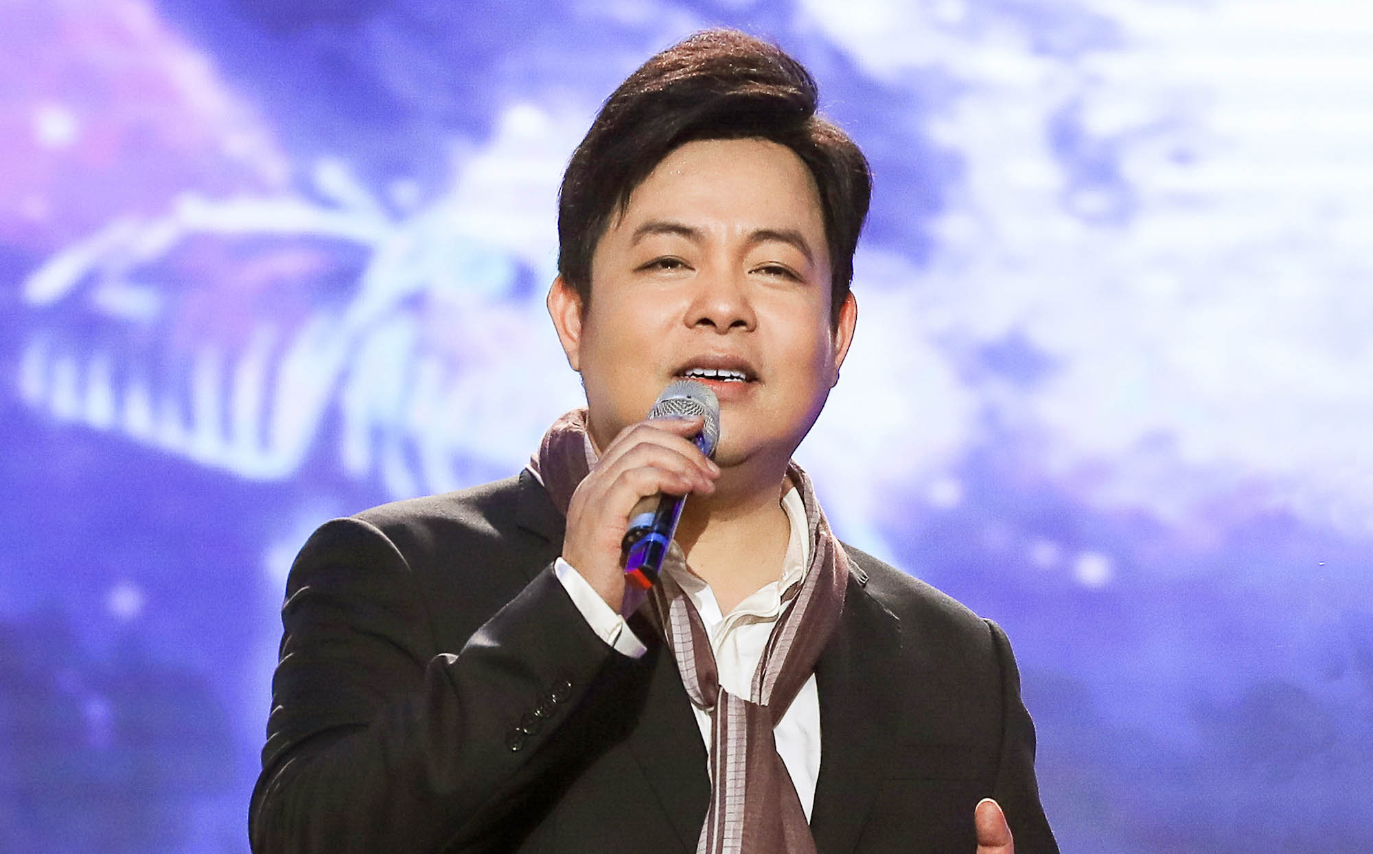 gioi-thieu-ve-ca-si-quang-le